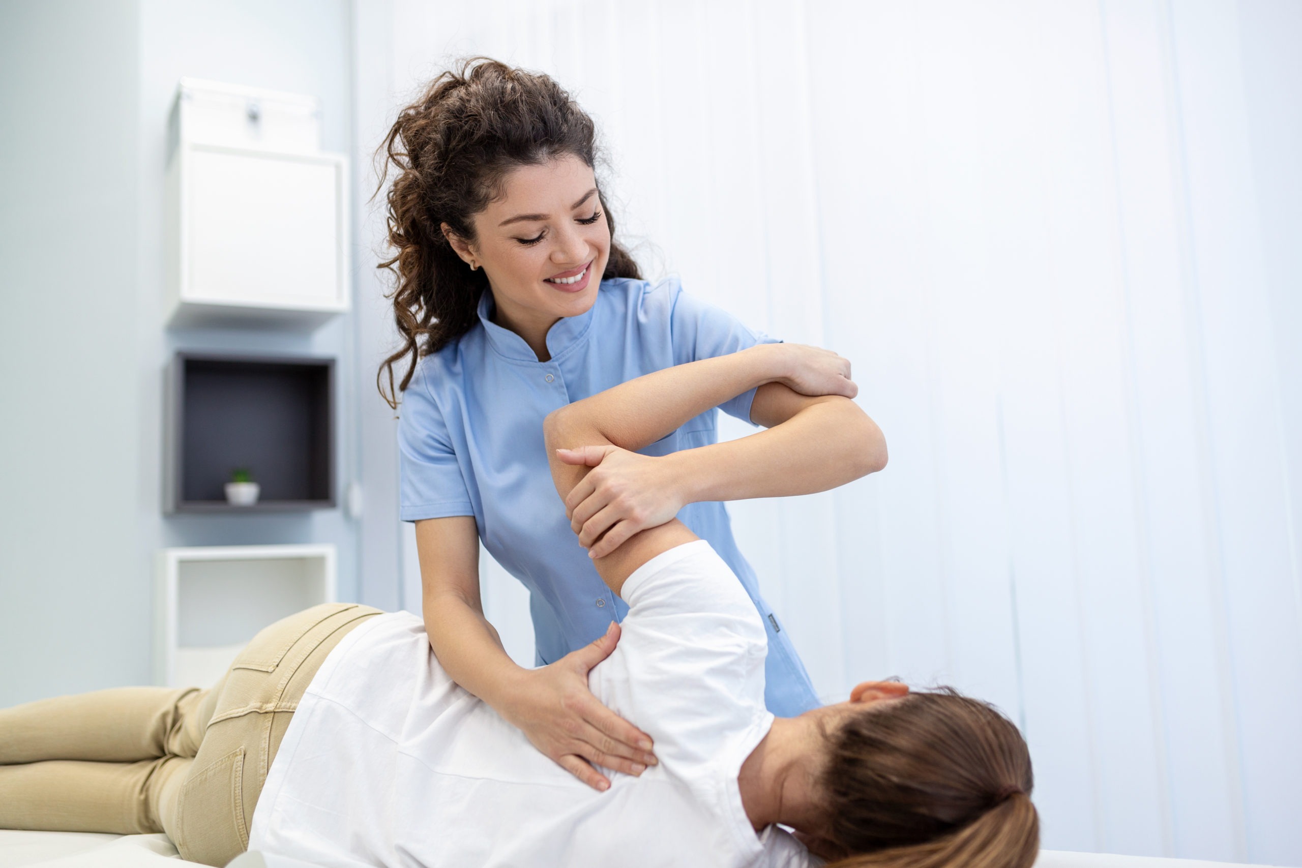 physical therapy being performed on a shoulder